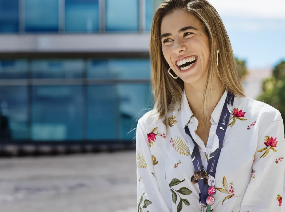 Happy TP employee smiling with pride in being part of the company.