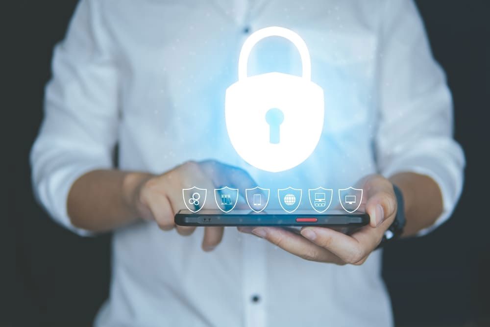Person holding a tablet with 3D security elements