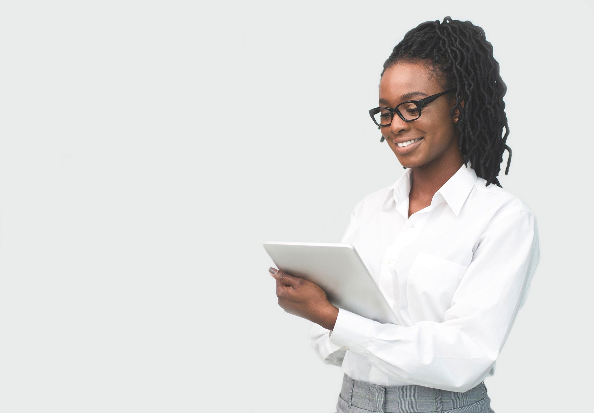 African business woman reading on a tablet