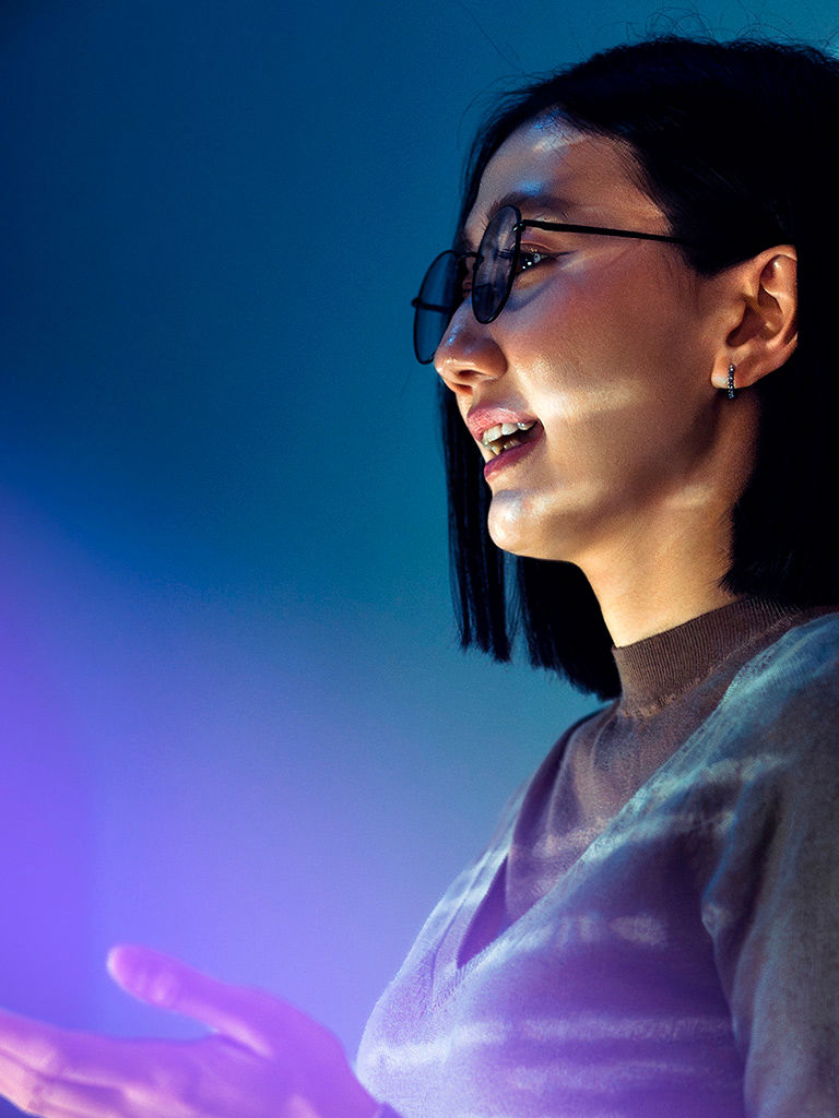 Asian professional delivering a business presentation.